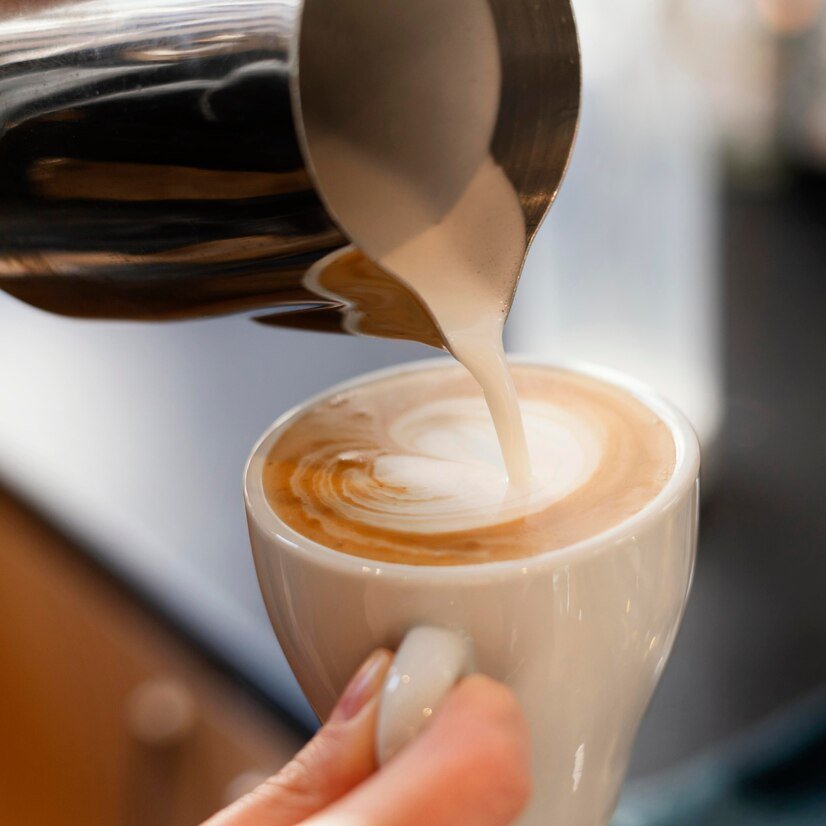 close-up-hand-holding-coffee-cup_23-2148892838