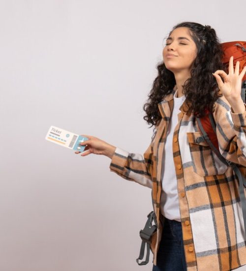 front-view-young-female-going-hiking-holding-ticket-white-background-air-tourist-forest-vacation-flight-trip-campus-mountain_179666-39189