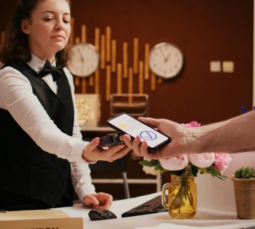 retired-guest-using-mobile-payment_482257-81576