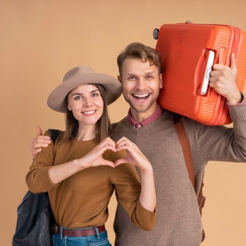 smiley-couple-ready-traveling-with-luggage_23-2149205288 smiley-couple-ready-traveling-with-luggage_23-2149205288